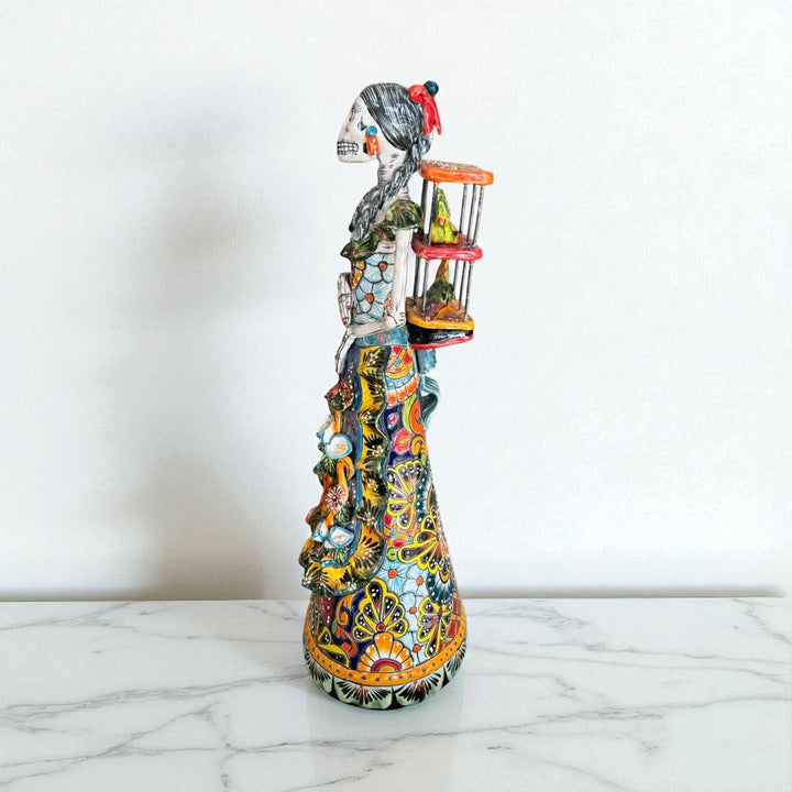 Medium Handmade Talavera Catrina Figurine, Colorful Day of the Dead Skeleton with Canary Birdcage